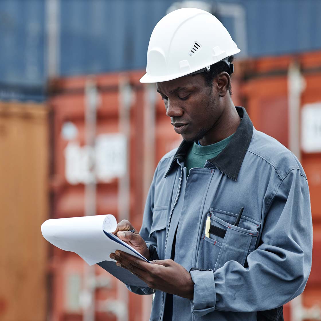 Program graduate at work on a shipping dock